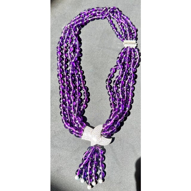 Introducing our exquisite Platinum Natural Amethyst Multi Layer Bead Necklace, adorned with a stunning 9 carats of fine...