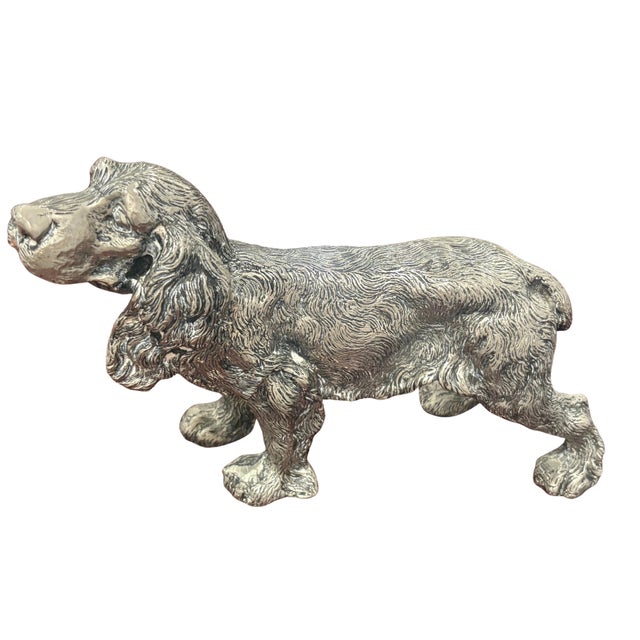 Vintage Gucci figural dog sculpture depicting a spaniel in a lively standing pose with one paw raised. Made in Italy, the...