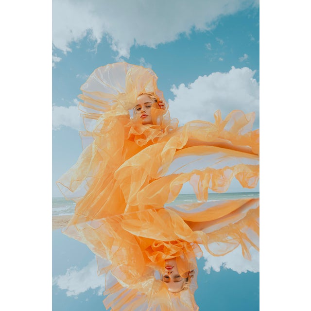 This stunning color photograph, "Floating Away II," captures an ethereal moment where the subject seems to dissolve into a...