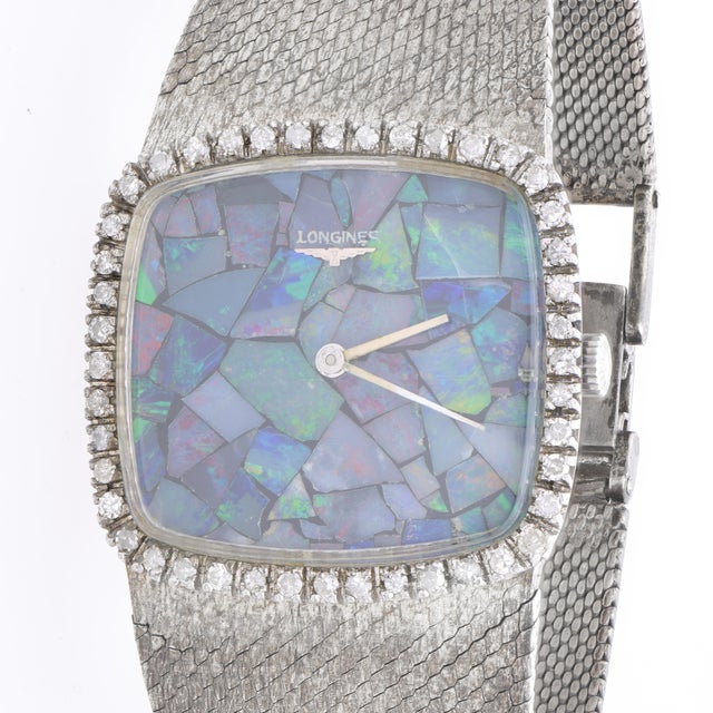 Vintage Longines 1973 watch features a spectacular mosaic black opal inlay dial with 44 round brilliant diamonds totaling...