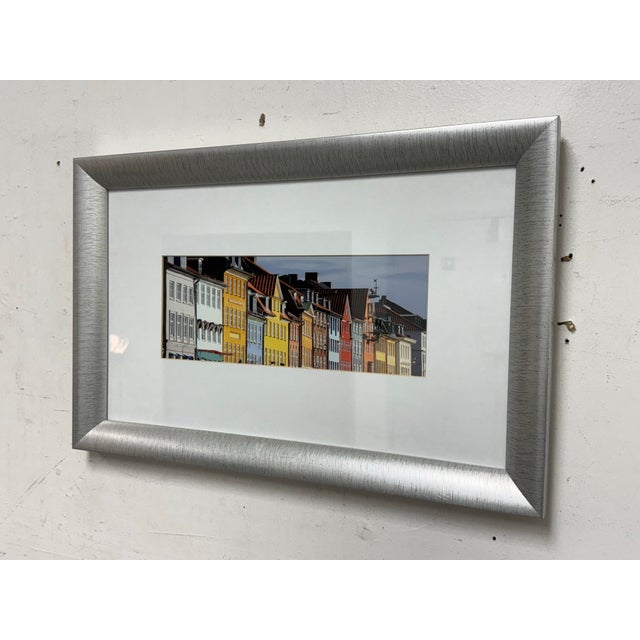 Design Plus Gallery presents a Framed Print of the Colorful Homes of Copenhagen, Denmark. A talented composition from an...
