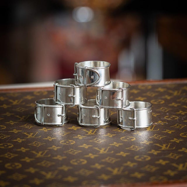 Vintage 20th century english solid silver set of six napkin rings. Each napkin ring is styled in the form of a belt with...
