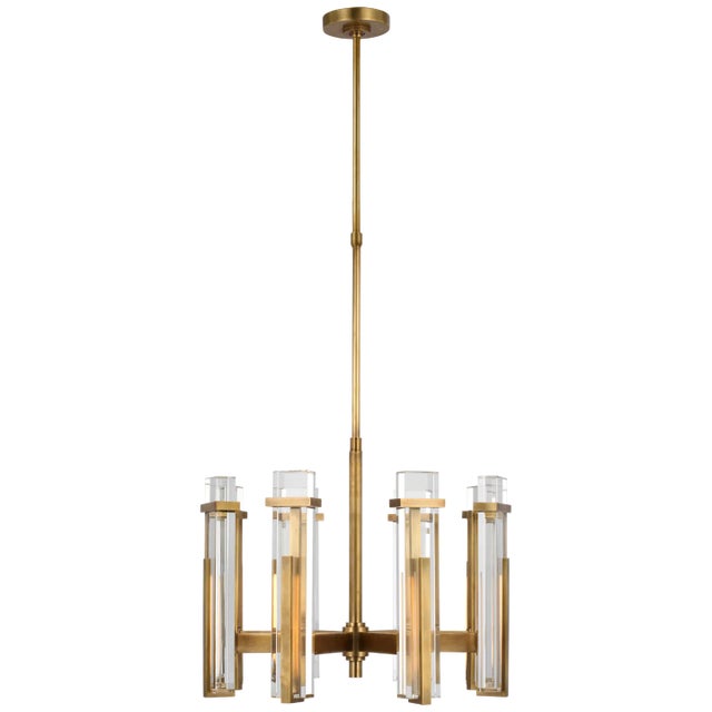 Malik Medium Chandelier in Hand-Rubbed Antique Brass with Crystal Designer: Ian K. Fowler Fixture Height: 19.5" Min....