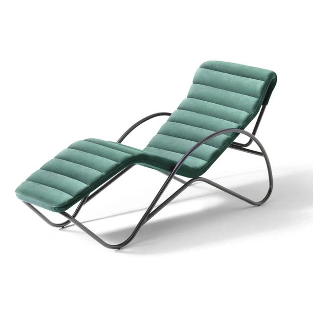 Charlotte perriand indochine blue chaise lounge manufactured by cassina a symphony of modern lines an iconic chaise longue...