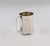 Silver jug is a precious decorative object realized in 20th century. Very precious little silver jug with handle. In good...