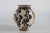 Danish ceramic handmade vase by Herman A. Kähler. The vase has a matte sand colored basecoat with abstract hand-decorated...