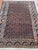 Antique Persian rug, hand-knotted in Iran from 100% wool. Measuring 4’9” x 6’8”, the rug features a striking all-over...