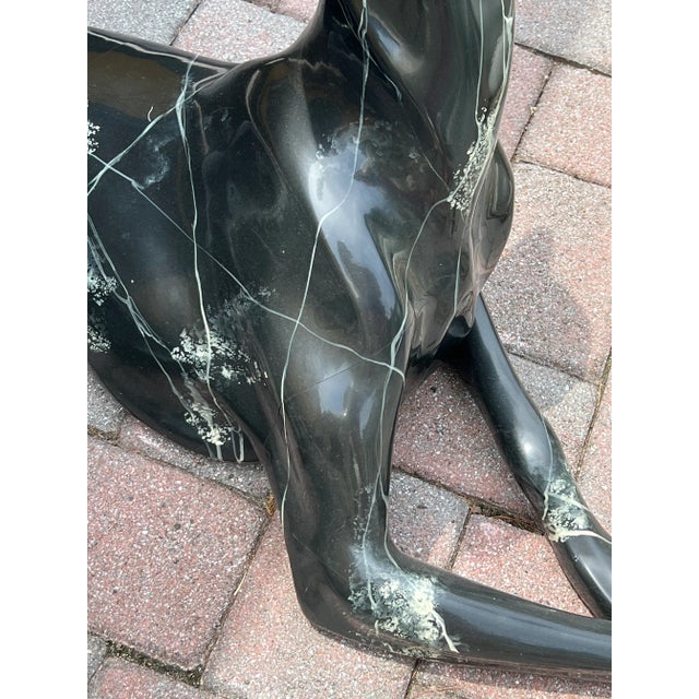 Contemporary Fiberglass Greyhound statue made in the late 90s The greyhound dog is lounging on the floor waiting for the...