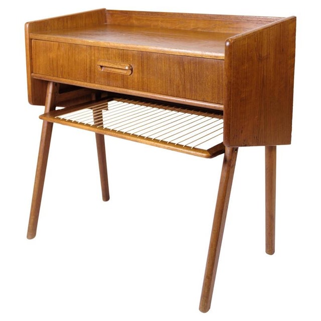 Side table/nightstand in teak with drawer and wicker shelf. Danish design from the 1960s. Elegant and functional furniture...