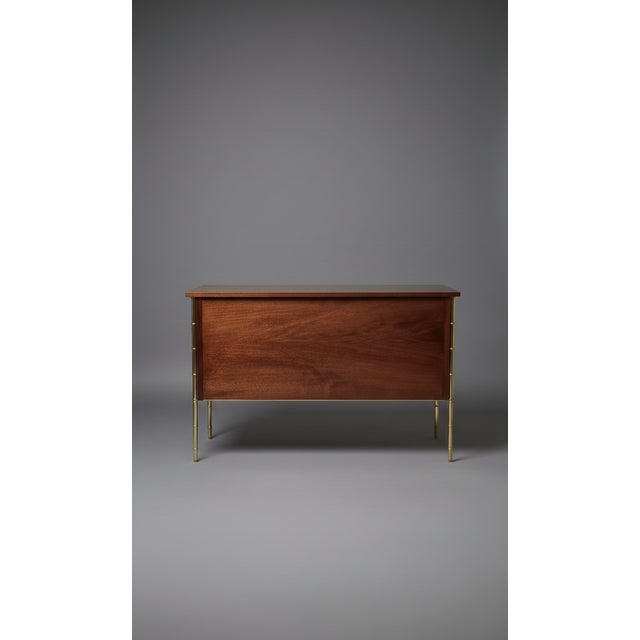 Magnificent two-drawer chest of drawers with brass legs and handles. Drawers lined in burgundy velvet.