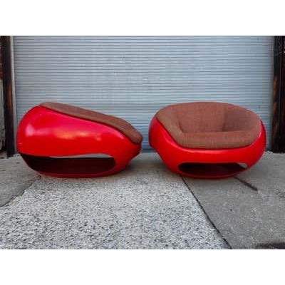 Mario Sabot Pod Chairs, sold as a pair. Fiberglass outer bodies with Upholstered interiors. Cut out design to the...