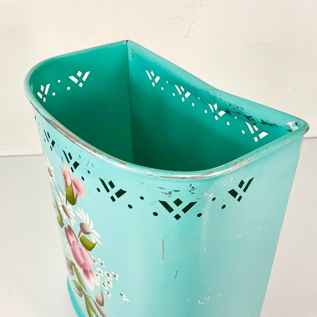 A beautiful Aqua Turquoise hand-painted flora design Metal Wastebasket from the 1950s. The colors are stunning and even...