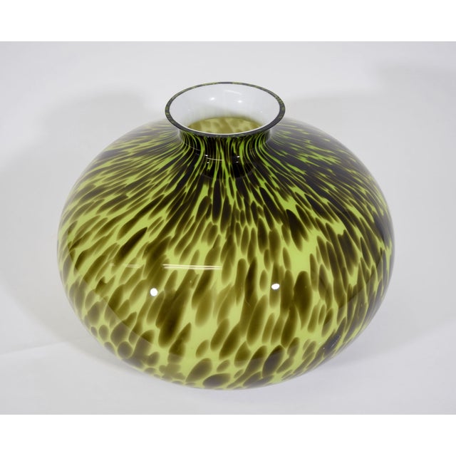 The colors on this are beautiful. Condition is excellent. This is great for a centerpiece, on a shelf or tabletop.