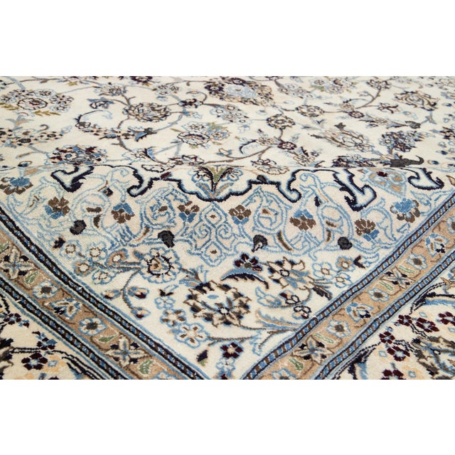 Elevate your space with the timeless elegance of this authentic Vintage rug. Masterfully hand-knotted from high-quality,...