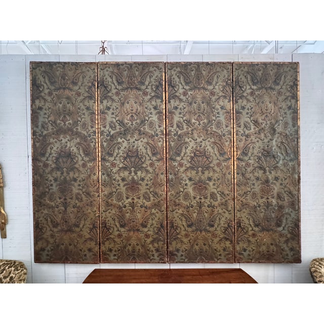 This is a wonderful four-panel folding screen covered in embossed and polychrome leather, the surface worked in a rich...