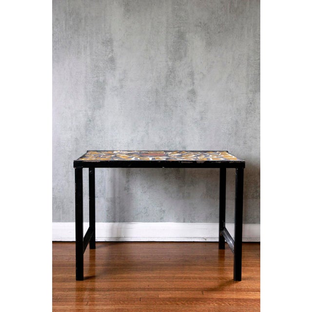 This eye-catching 1960s French side table is a true statement piece, boasting a captivating mosaic top. The surface is...