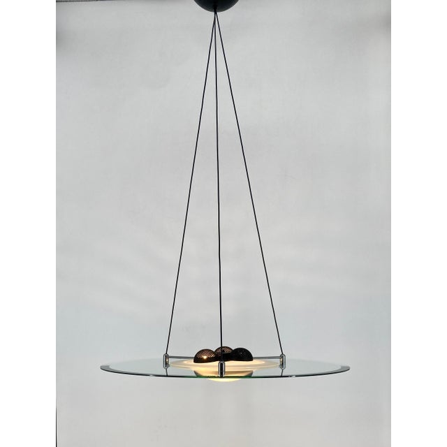 A lamp * designed by fabio di bartolomei * manufactured by the italian brand bieffeplast * made of glass and metal *...