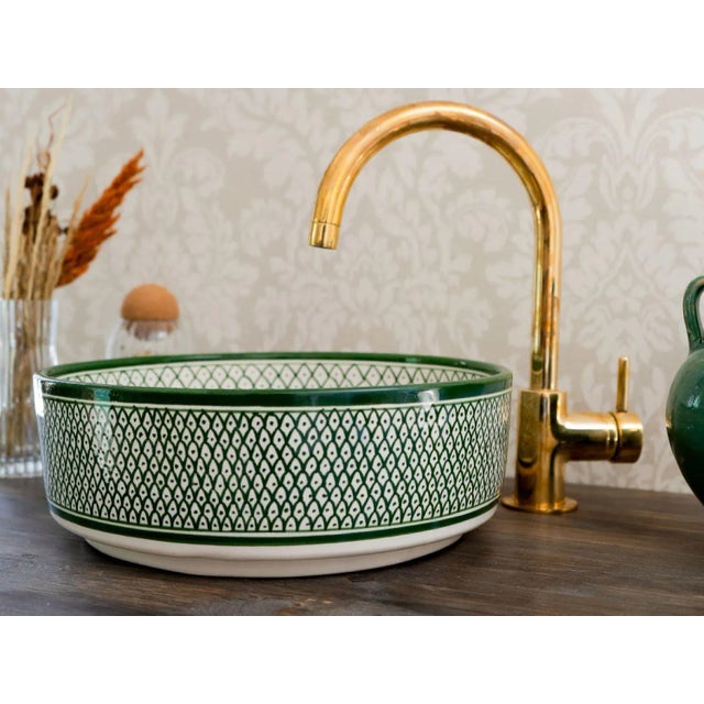1) Elevate the Beauty of your bathroom sink with our Sink. This ceramic vessel sink is skillfully handcrafted by our...