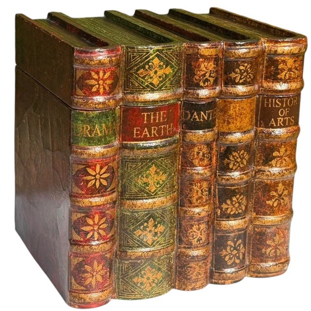 Vintage trompe-l’œil decorative box designed to look like a grouping of antique books. The exterior features richly aged...