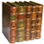 Vintage trompe-l’œil decorative box designed to look like a grouping of antique books. The exterior features richly aged...