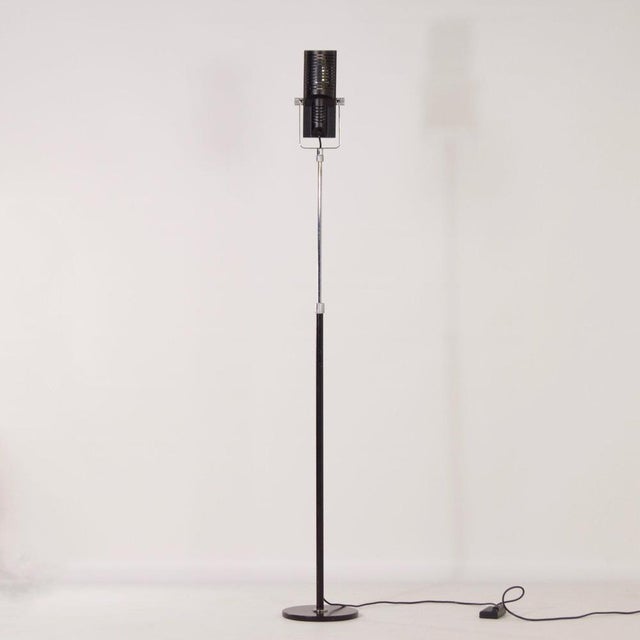 Italian floor lamp in the shape of a 1950s microphone made in the 1980s. Both the stand and the lamp itself are adjustable...