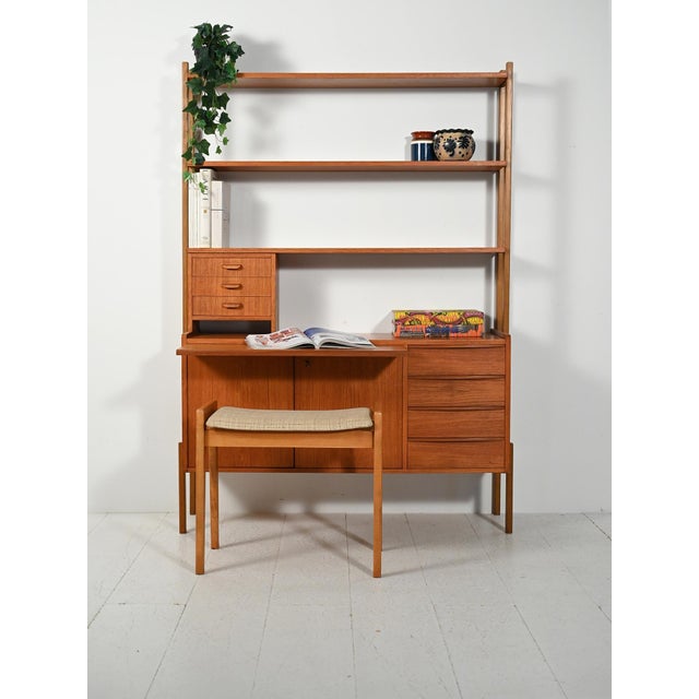 Scandinavian teak bookcase from the 1950s/1960s with a storage cabinet, pull-out desk, and a module of small storage...