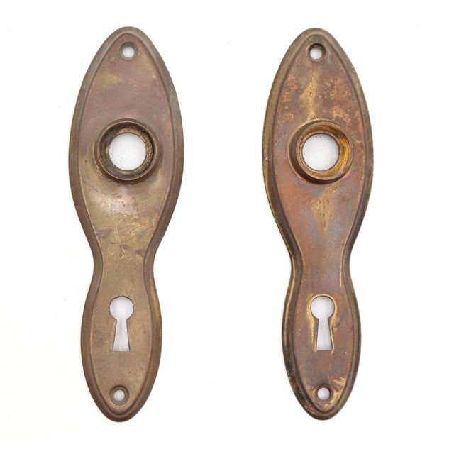 Vintage dummy door knob set made with round wooden knobs and brass finished back plates. One plate is made of steel, and...
