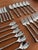 Vintage Stainless Steel Cutlery Service with Twisted Handles, 1990s, Set of 24 For Sale - Image 3 of 6