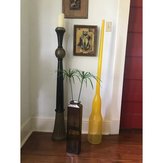 This tall, sculptural 1980s blown glass vase features a bold yellow hue and sleek, modernist design. Standing at 57...
