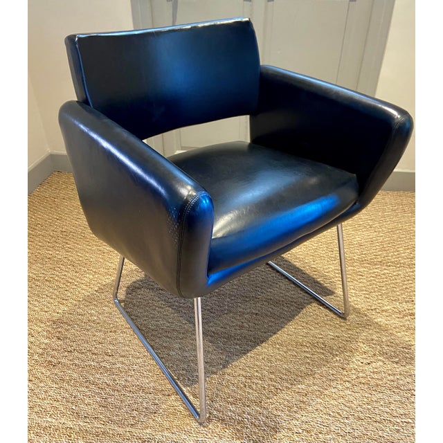 This elegant mid-century armchair was produced in France by Steiner and is attributed to the renowned designer Joseph-...