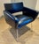 This elegant mid-century armchair was produced in France by Steiner and is attributed to the renowned designer Joseph-...