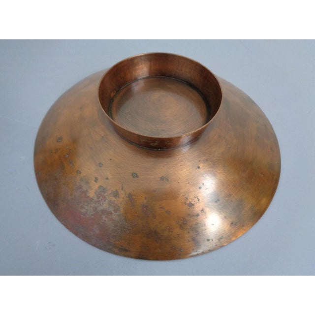 Bowl made of massive copper with psychedelic pattern.