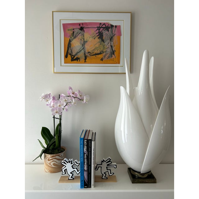 Intense pink and orange paint and paper, overlayed and ripped paper, bold black abstract paint strokes and tissue paper...