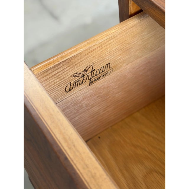 W65 D18.5 H33 (D20 w/ handle) Crafted with an immense attention to detail, this restored walnut dresser designed by Merton...