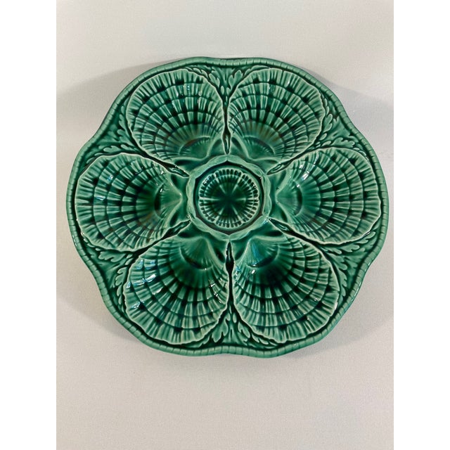 A striking deep green French Majolica Sarreguemines Oyster Plate, circa 1930s. Signed Sarreguemines on the back and marked...