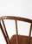 This antique Windsor bow back chair features a continuous curved crest rail, tapered spindles, and turned legs with simple...