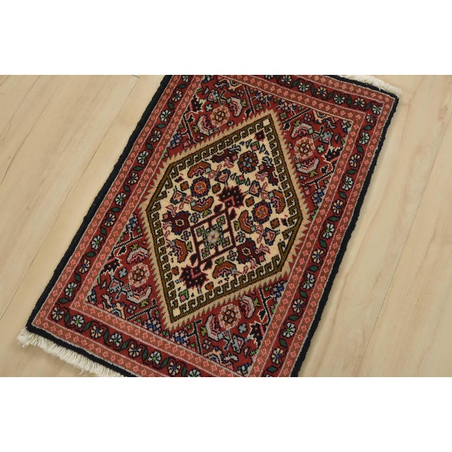An authentic vintage tribal Bidjar rug hand-knotted with fine wool and natural dyes. This finely woven oriental rug...