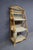 Italian-style etagere constructed of bent bamboo with woven wicker shelves and back panels. Features decorative spiral-...