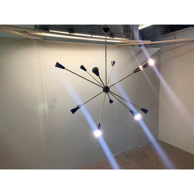 Sputnik Stilnovo Chandelier Restored 50s in brass, aluminum cones. This piece has an attribution mark, I am sure that it...