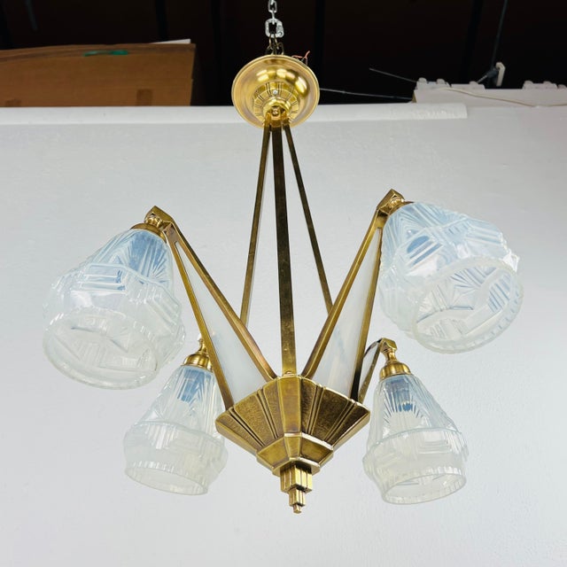 French Art Deco chandelier in style of Degues. This ceiling light is a remarkable example of the craftsmanship and style...