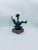 A collectible art-style sculpture made of polyester resin. The figurine features a dynamic form immortalizing a football...