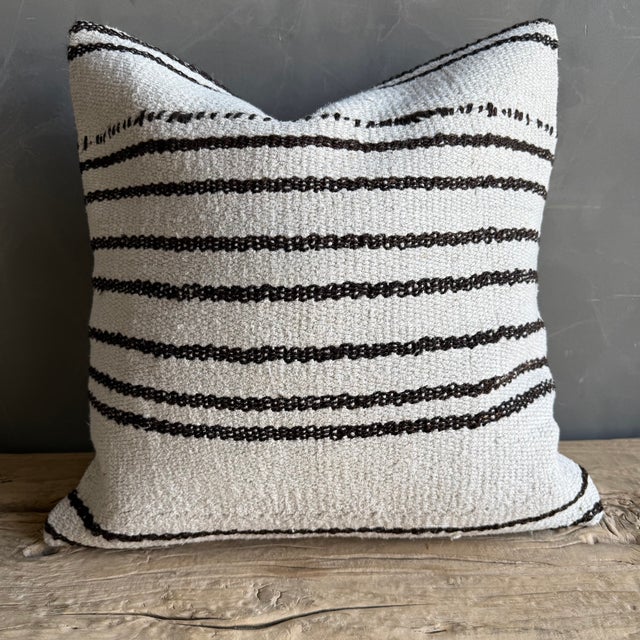 Creamy white hemp rug pillow with stripes. Soft hand, linen blend backing with zipper closure. Spot cleaning is...