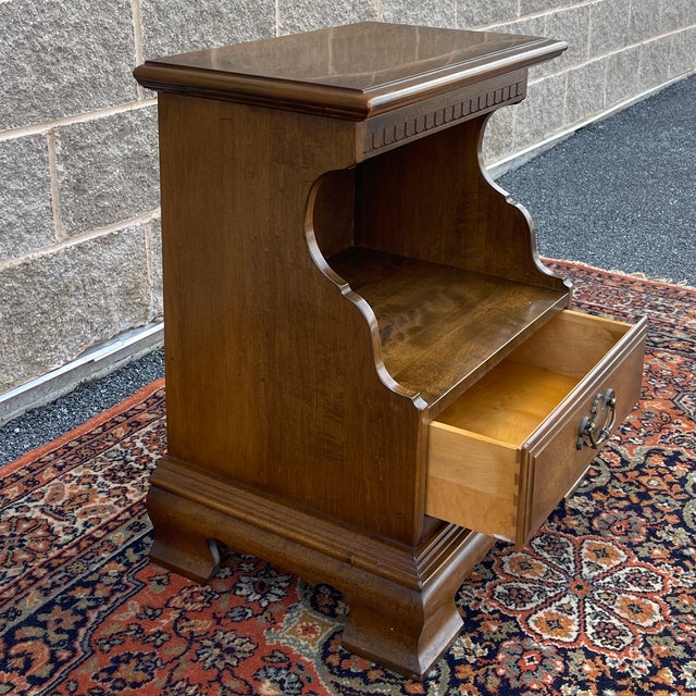 A vintage Ethan Allen Classic Manor collection Traditional solid maple nightstand having an open storage area over one...