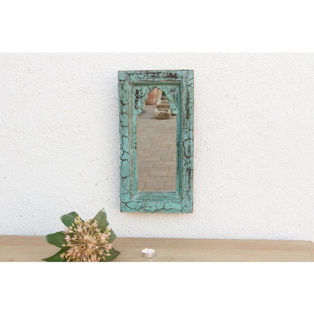 Bring the charm of old-world India into your home with this petite architectural mirror. Modeled after traditional...