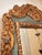 This vintage mirror features an ornate carved wood, hand gilt and painted frame with a gorgeous celadon green accent color...