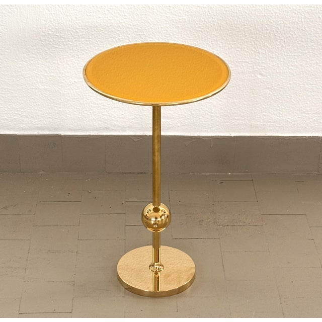 Iconic side table made in full brass and painted glass top in yellow color. Designed in the 1940s by Osvaldo Borsani and...