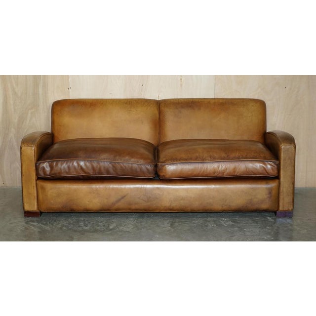 Lovely vintage hand made in England Art Deco Odeon style brown leather sofa with overstuffed feather filled cushions. A...