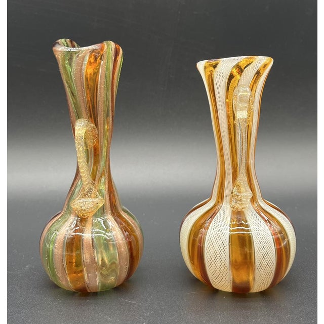 These two antique Murano handled vases were crafted in the finest Venetian glass tradition on the island of Murano, famous...