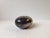 This egg-shaped flower vessel was designed and manufactured by Carl Cohr in Fredericia, Denmark during the 1950s. The...