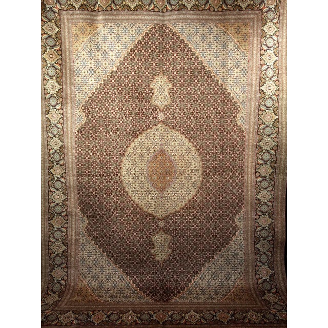 Vintage Persian Tabriz room-size rug in a geometric “Mahi” pattern. The beautiful Tabriz Mahi was woven with very fine...